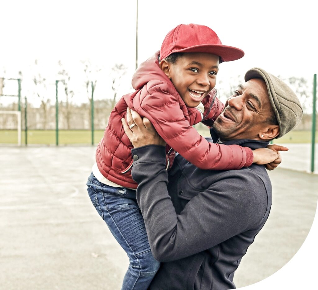 father and son smiling  together